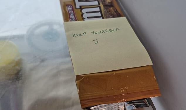 An office worker recently sparked debate online after discovering a note placed on their personal snacks in the workplace fridge - inviting everyone to help themselves