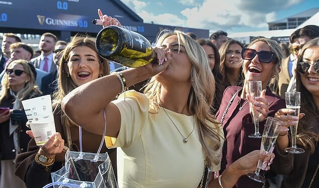 Plenty of bottle: Ladies Day at Cheltenham returned with a bang - and plenty of fizz