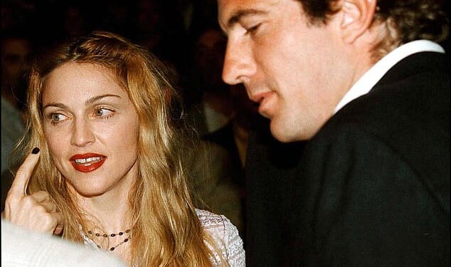 JFK Jr proved to be a hands-on editor brimming with ideas, but the weirdest of them all was his suggestion for a front cover for a 1996 issue that involved dressing Madonna up as his mother (Pictured together in 1997)