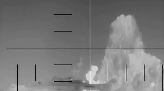 Footage showed a huge explosion beneath her stern (pictured)