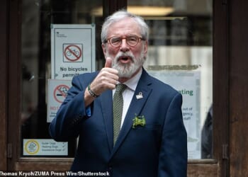Former Sinn Fein president Gerry Adams gives the thumbs up as he arrives for his landmark civil trial