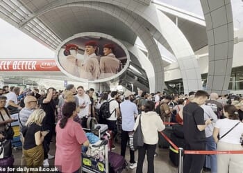 Frightened holidaymakers and British nationals scramble for flights home, with some families paying up to £100,000 for private jets to escape the war-shaken Gulf state. Pictured: Dubai airport this week