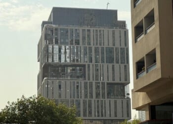 A damaged building in DIFC Dubai, after debris from a successful interception caused minor damage to the facade, amid the U.S.-Israeli conflict with Iran, in Dubai, United Arab Emirates, March 13, 2026. Picture taken with a mobile phone. REUTERS/Stringer