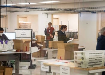 Election workers tabulate and adjudicate remaining ballots at the Maricopa County Tabulation and Election Center in Phoenix, Arizona, on Nov. 6, 2024.