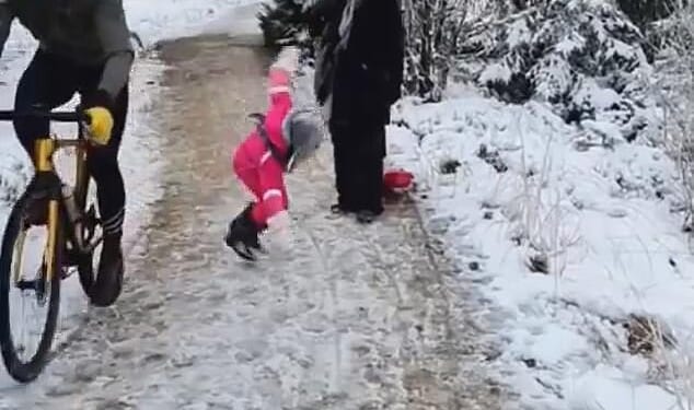 A father who was ordered to pay compensation to a cyclist for filming him as he knocked over his young daughter has finally won his legal battle. The Belgian cyclist (left) went viral after he was filmed kneeing the little girl as he rode past her and her family