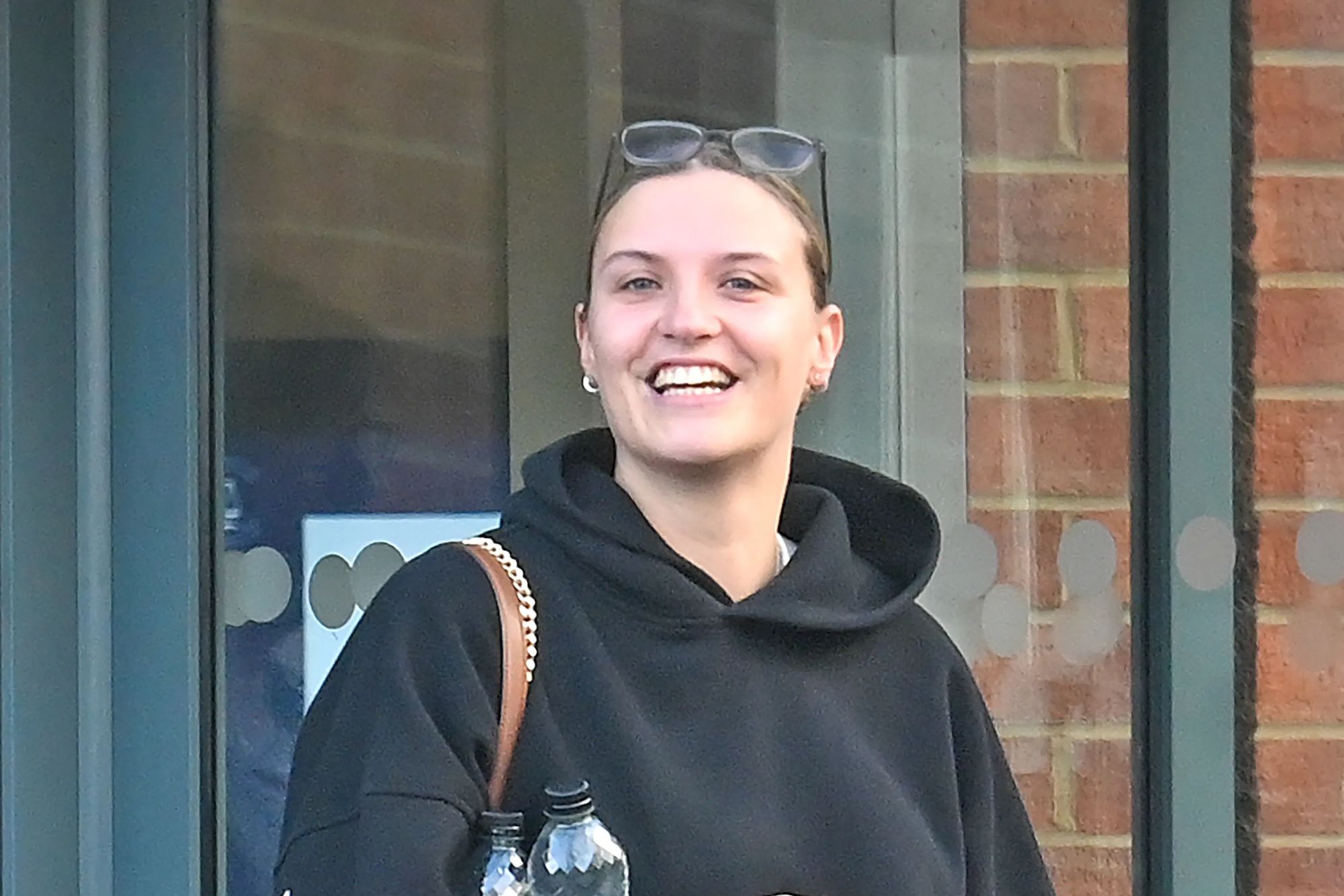 An image collage containing 1 images, Image 1 shows Sian Dowsett smiles while standing outside Bulford Military Court
