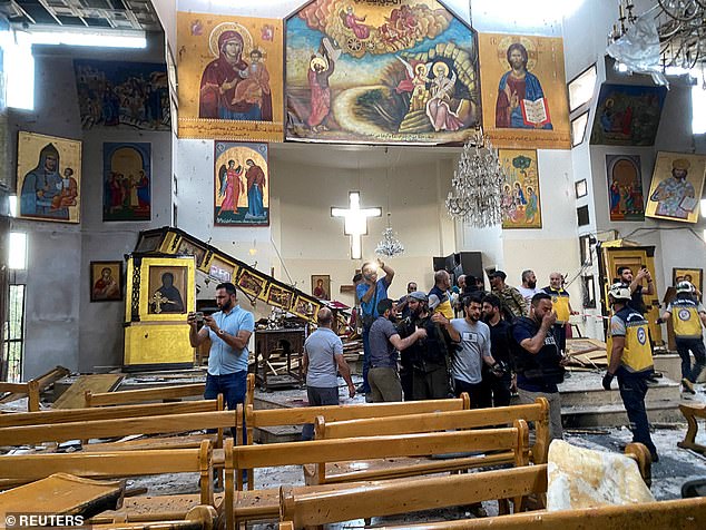 Civil defense members inspected the damage after a blast rocked the Mar Elias Church in Damascus, Syria, on June 22, 2025