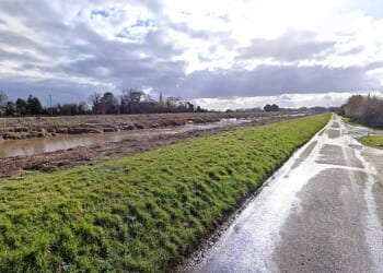 A frantic search is on for two missing teenagers after a car with five youngsters inside plunged into a river near a road in Wisbech St Mary, Cambridgeshire, pictured