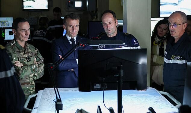 Emmanuel Macron has ordered French Navy ships to the Strait of Hormuz in an 'unprecedented' bid to combat skyrocketing oil prices (The French President, middle left, is pictured at the bridge of a warship on Monday)