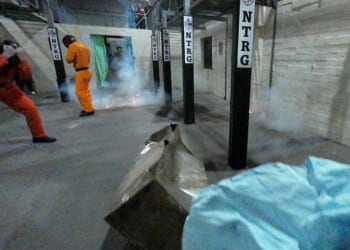Flashbangs explode during a training exercise at the headquarters of the Operational Response and Resilience Unit (ORRU) in Kidlington, Oxfordshire