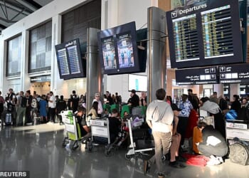 Frightened holidaymakers and British nationals scramble for flights home. Pictured: Dubai airport this week. Pictured: Passengers wait at Muscat International Airport