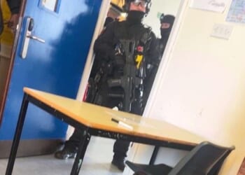 This is the moment a 15-year-old boy is arrested by armed police after a teenage girl pupil is stabbed at school