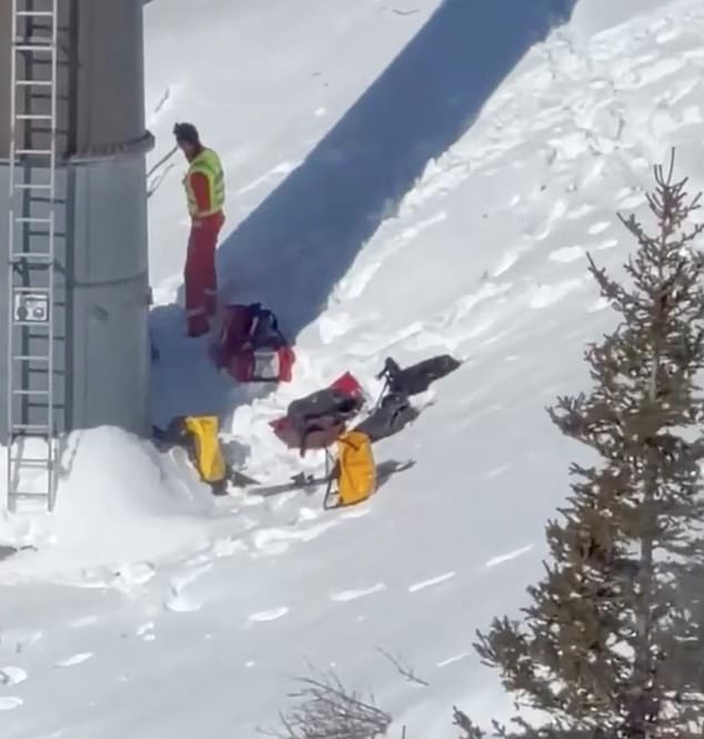 One image shows the rescue operation underway. One person was carried away by rescuers, according to local media