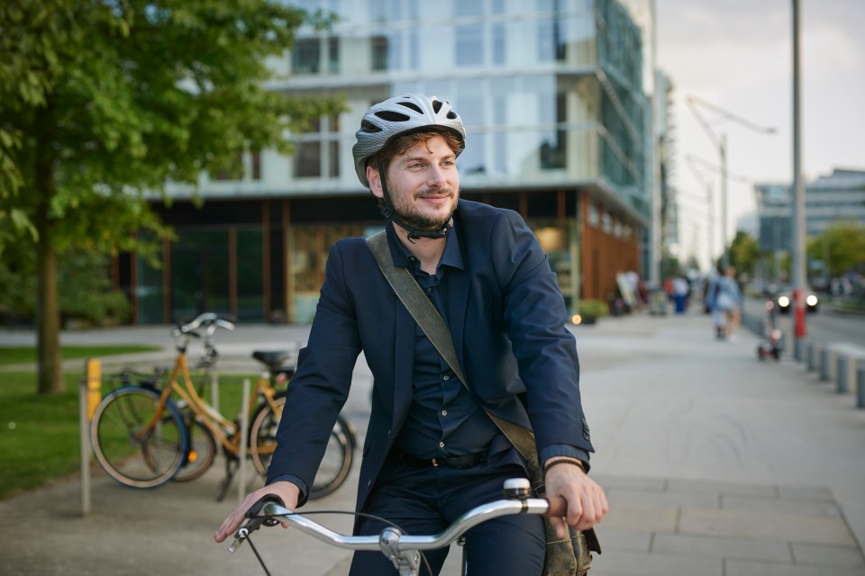 Businessman cycling in the city.