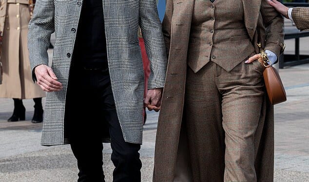 Hannah Waddingham, 51, held hands with spine surgeon Nick Beresford-Cleary as they arrived at Cheltenham Festival on Friday