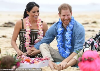 The Duke and Duchess of Sussex are returning to Australia next month - they are pictured here during a previous visit to the country, on Bondi Beach in Sydney in October 2018