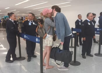 Emma Watson, 35, was bare-legged and in flip-flops, shared a tender kiss with her beau Gonzalo Hevia Bailleres in a Mexican airport last week