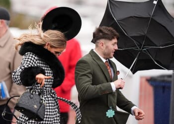The windy weather at Cheltenham Festival today proved to be too much for some racegoers who struggled to control their brollies – or worse, lost hold of their hats
