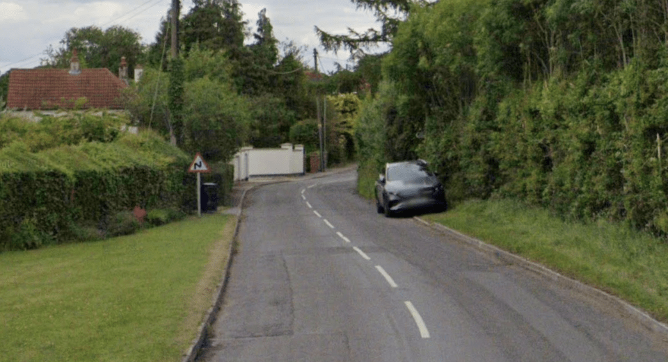 Main Street in Milton, with a car parked on the right side of the road.