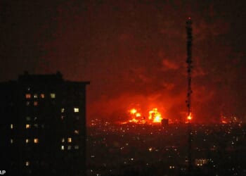 Flames rise from an oil storage facility south of the capital Tehran as strikes hit the city during the US-Israel military campaign, Iran, Saturday, March 7, 2026