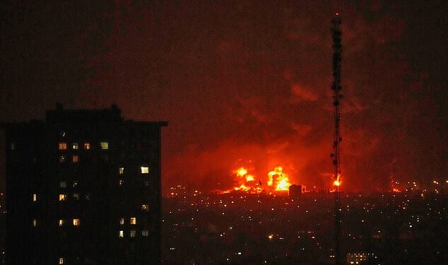 Flames rise from an oil storage facility south of the capital Tehran as strikes hit the city during the US-Israel military campaign, Iran, Saturday, March 7, 2026