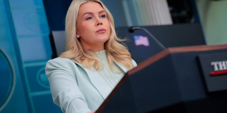 Karoline Leavitt stands at the podium as she gives press briefing on March 25, 2026.