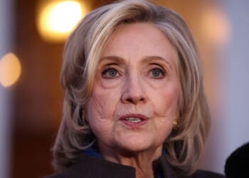 Former Secretary of State Hillary Clinton speaks to the news media Thursday in Chappaqua, New York, after her deposition with the House Oversight Committee as they investigate links to convicted sex offender Jeffrey Epstein.