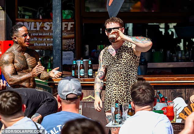 A man downs a pint at a bar in Benidorm. Brits reportedly make up over 40 per cent of Benidorm's visitors over the course of a year. Nearly 900,000 UK travellers visited the city in 2024