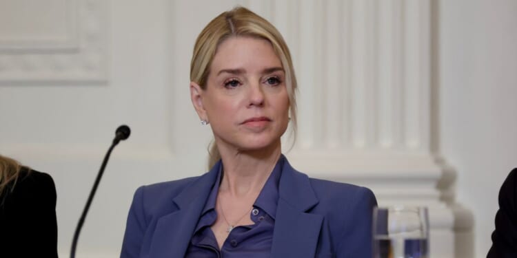 Attorney General Pam Bondi listens as President Donald Trump speaks during a lunch with the Trump Kennedy Center Board Members in the East Room of the White House on March 16, 2026, in Washington, D.C.