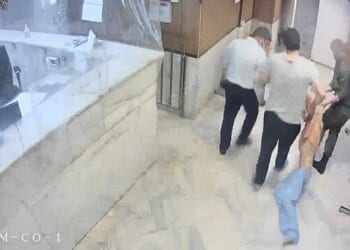 One nurse, 33, was held in detention and repeatedly gang-raped by three IRGC agents at a time for three days, according to Iran International. (Pictured: IRGC guards drag an emaciated prisoner, at Evin prison in Tehran)