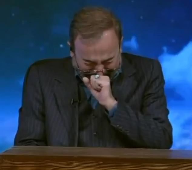 A news anchor weeps as he formally announces the death of the Supreme Leader
