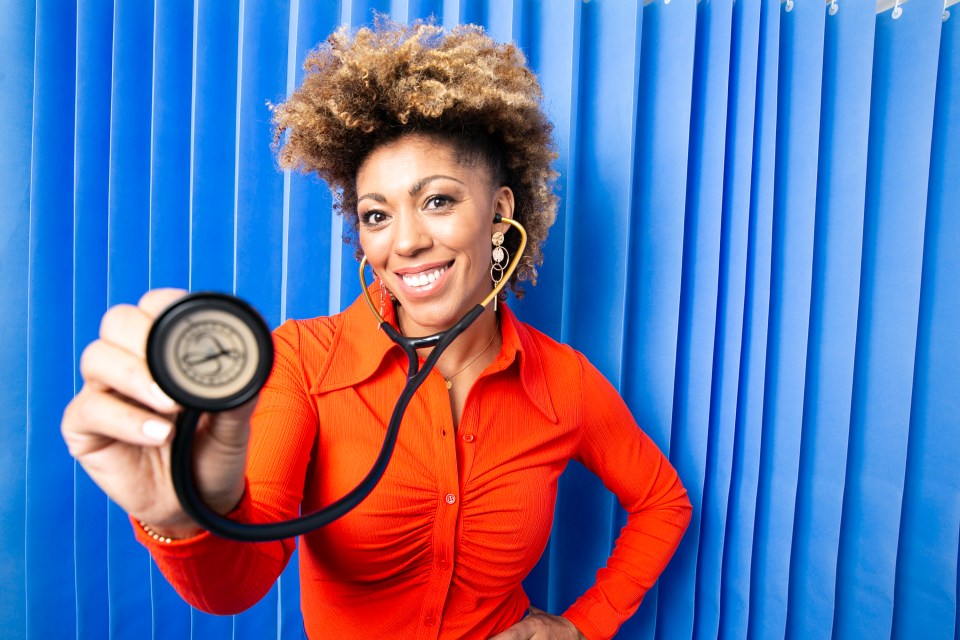 Dr. Zoe holding a stethoscope toward the viewer.