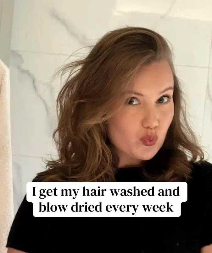 A woman with styled brown hair and pursed lips looking at the camera, with text about getting her hair washed and blow dried weekly.