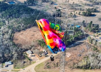 A man and a woman, who have not been identified, were rescued from the hot air balloon after it crashed into a radio tower in Texas at around 8.15am on Saturday