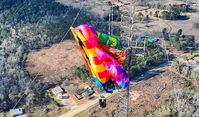 A man and a woman, who have not been identified, were rescued from the hot air balloon after it crashed into a radio tower in Texas at around 8.15am on Saturday