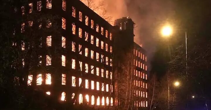 Inferno rips through historic building as homes evacuated and fire crews battle blaze saying 'completely avoid area'