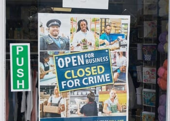 A sign on the door of Braintree's Sue Ryder charity shop warns of the consequences of crime