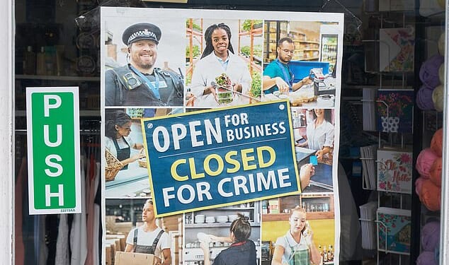 A sign on the door of Braintree's Sue Ryder charity shop warns of the consequences of crime