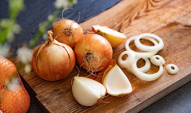 Experts say you may have been storing your onions wrong, as they reveal why you should never put them in the fridge (stock image)
