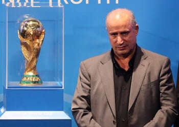 Iranian Football Federation president Mehdi Taj (pictured with the men's World Cup trophy) has launched an unhinged attack on Australia, accusing the government of abducting and taking players from the national women's team hostage