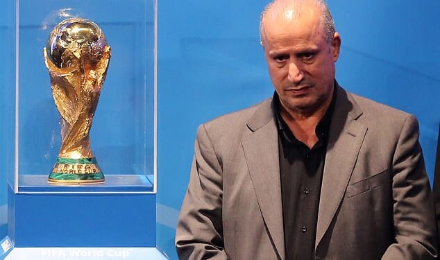 Iranian Football Federation president Mehdi Taj (pictured with the men's World Cup trophy) has launched an unhinged attack on Australia, accusing the government of abducting and taking players from the national women's team hostage