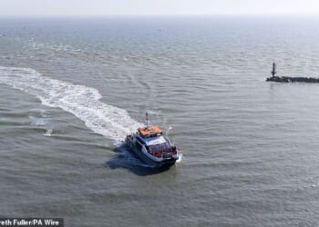 A group of people thought to be migrants arrive aboard a Border Force vessel travelling to Ramsgate in Kent on March 5 2026
