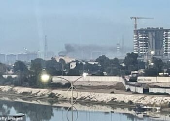 Smoke rises following a drone attack on the US embassy in Baghdad on March 14, 2026. A drone struck the US embassy in Baghdad on March 14, an Iraqi security official said, as an AFP journalist saw smoke rising from the complex. (Photo by AFP via Getty Images)