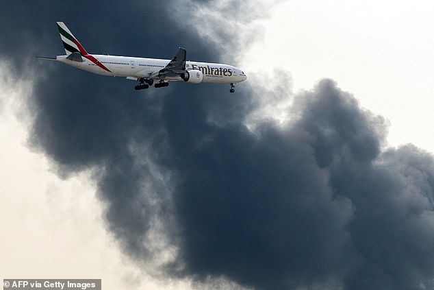 Flights to the major travel hub were temporarily suspended, though some still landed against a backdrop of smoke
