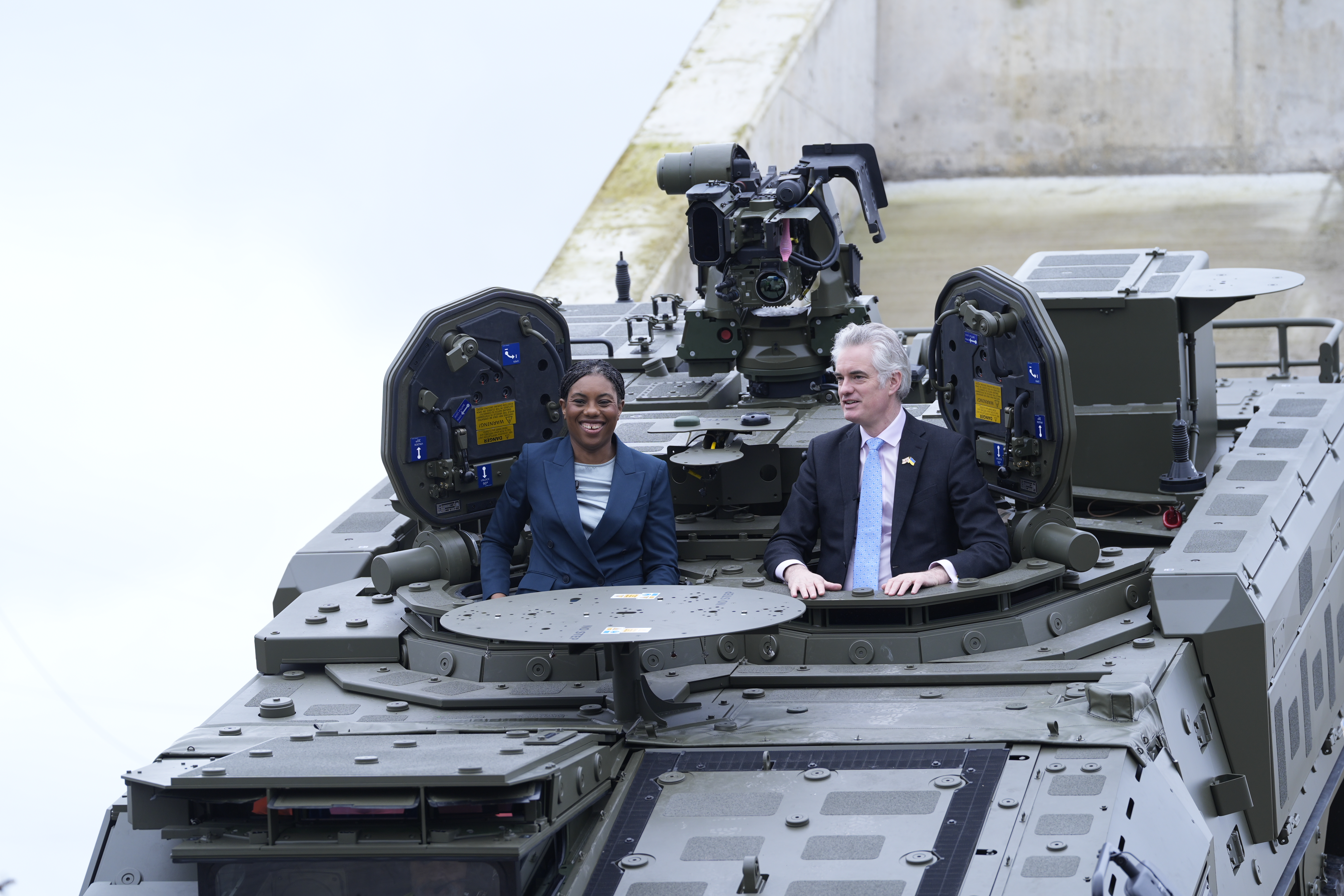 Kemi Badenoch and James Cartlidge in a Boxer tank.