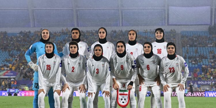 Islamic Republic of Iran players line up for a team photo prior to the AFC Women's Asian Cup Australia 2026 match between the Islamic Republic of Iran and Australia Matildas at Gold Coast Stadium on March 5, 2026, in Gold Coast, Australia.