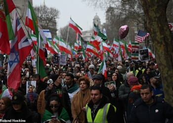 Thousands of Iranian protestors marched from Whitehall to the Iranian Embassy in London on Sunday calling for the British Government to proscribe the Islamic Revolutionary Guard Corps (IRGC)