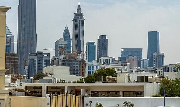 Katie Price's new husband lived in a rundown bungalow in Dubai with his dad weeks before marrying the model - who claims he's just splashed out on a £36million mansion