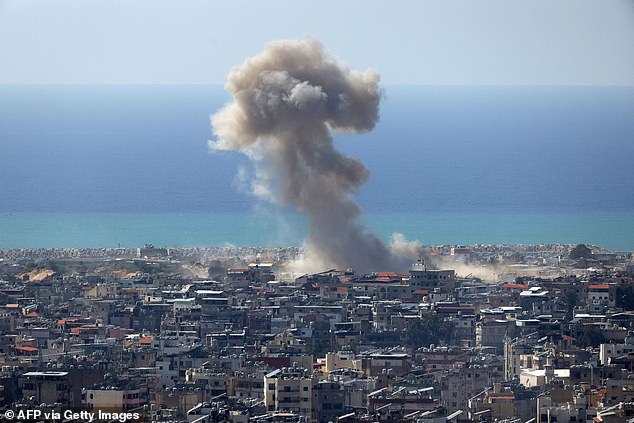 Smoke rises after an Israeli air strike on the southern suburbs of Beirut on March 17, 2026