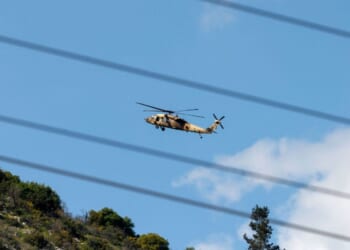 An Israeli Air Force UH-60 Black Hawk helicopter flies over the border area with southern Lebanon in northern Israel on March 2, 2026.